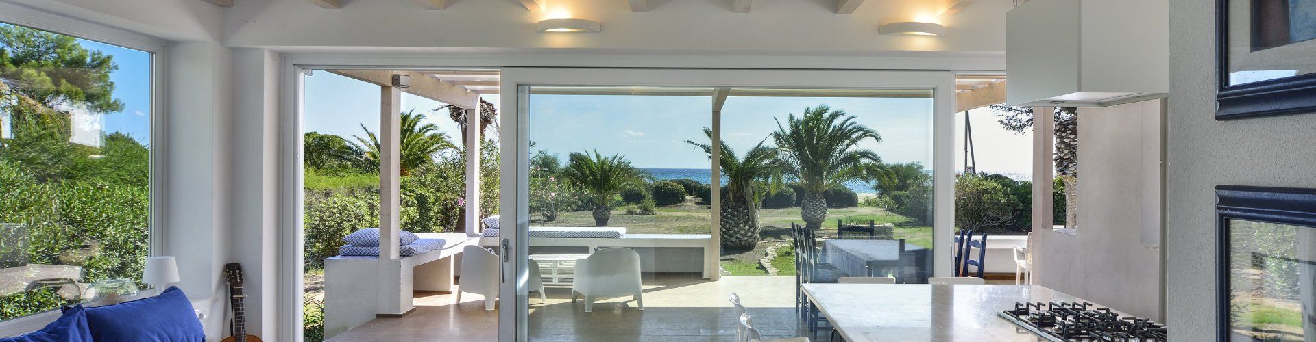 Modern dining and living room with a direct sea view 