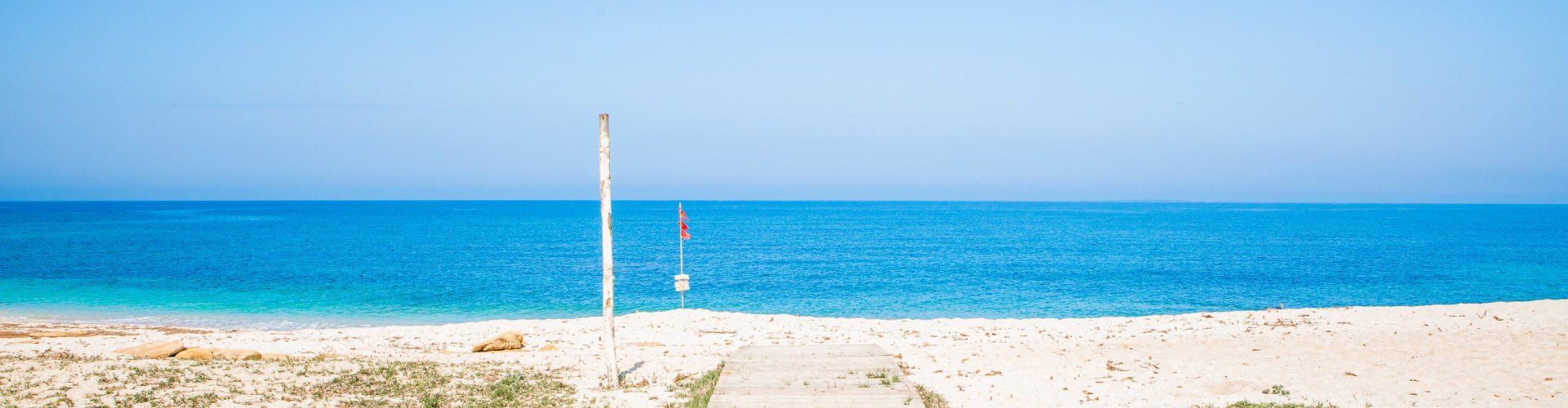 Walkway leading to the beach of Is Arutas