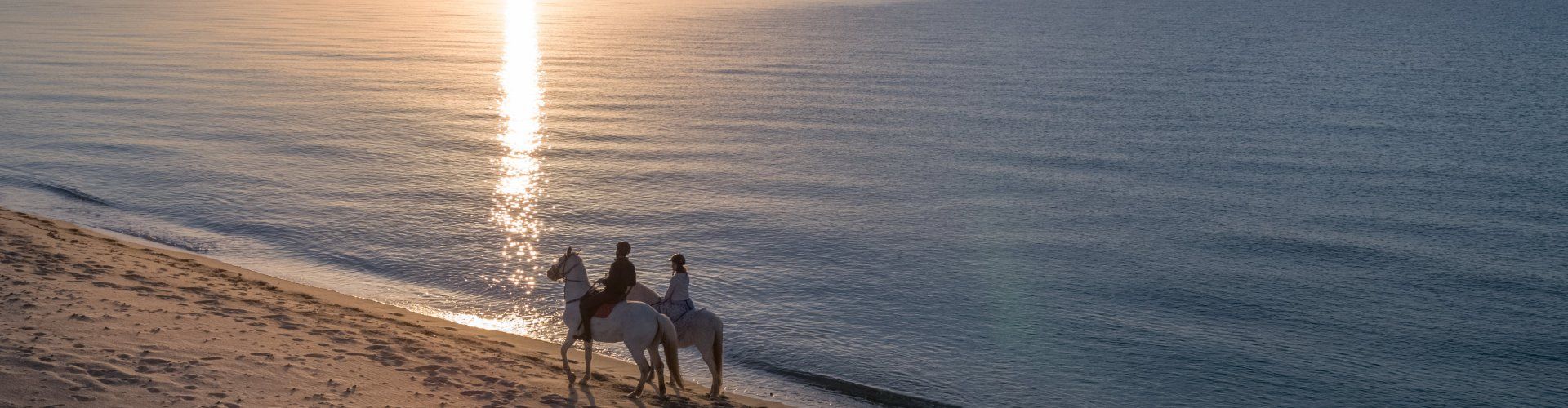 Horsebackriding at sunrise at Costa Rei