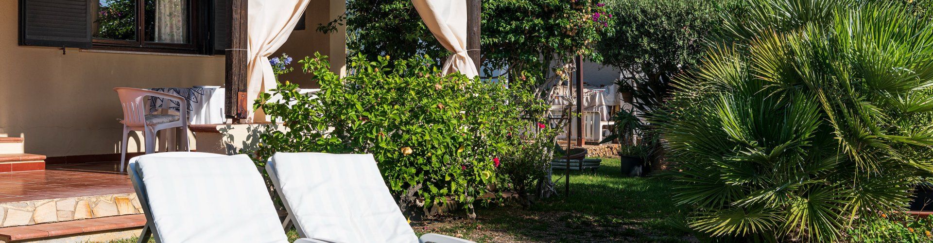 Villa Lucia | Garden with comfortable deckchairs for relaxing in the sun New Picture 2022