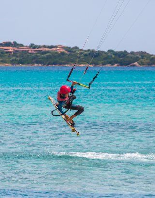 Kitesurfer on the beach La Cinta, San Teodoro, Olbia