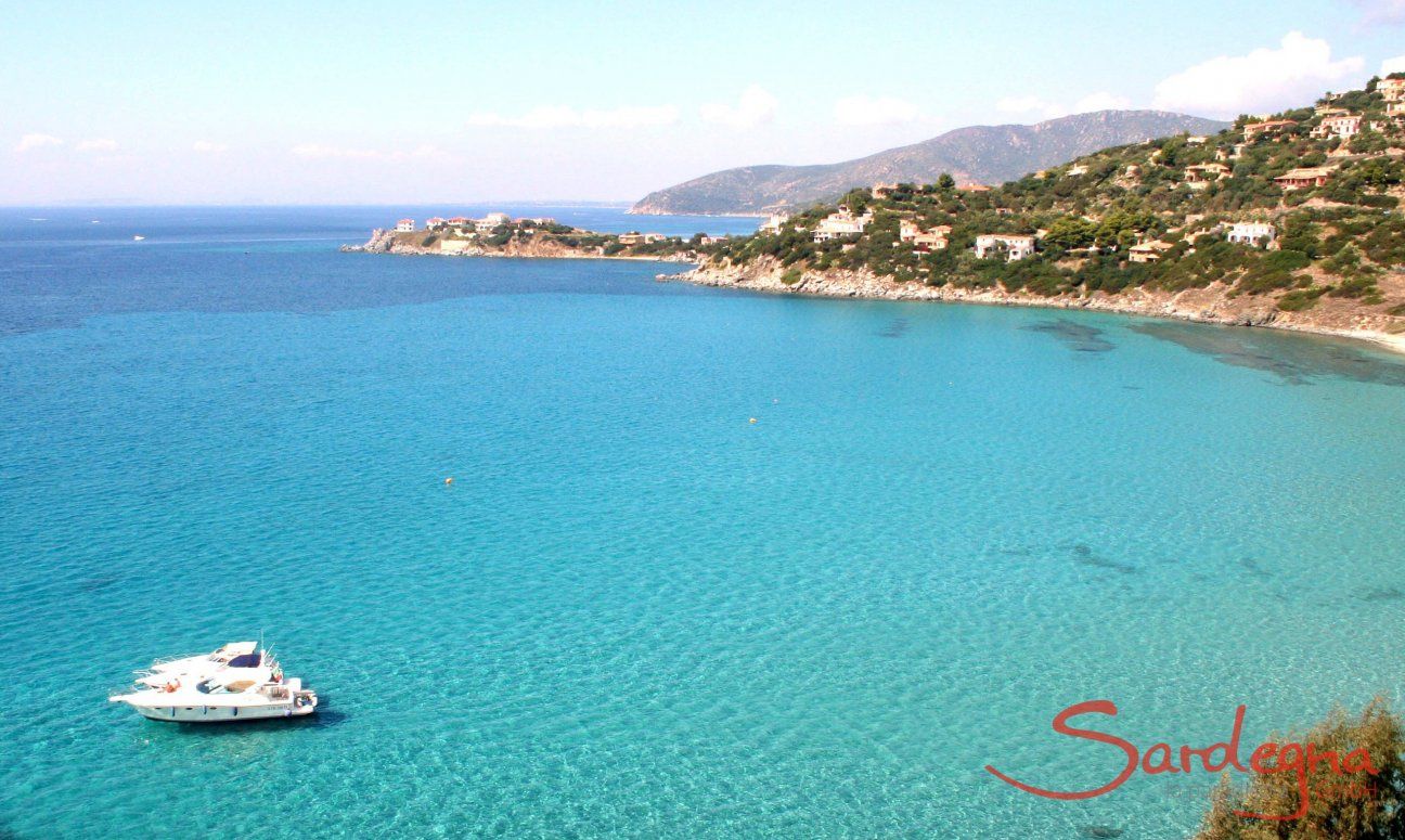 Bay of Torre delle Stelle, on the crystal clear sea hovers a small yacht