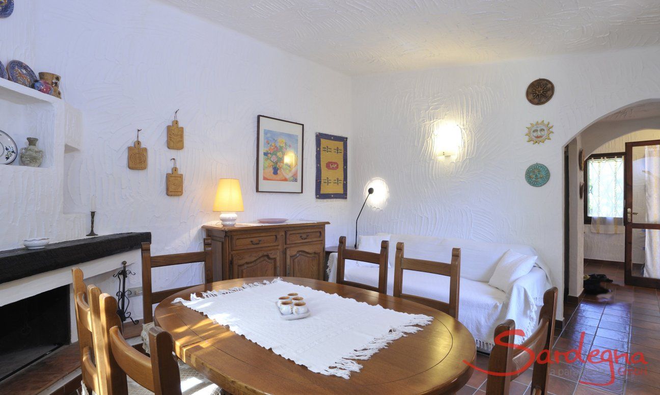 Casa Meloni 1 | Living room with sofa, dining table and fire place Living room
