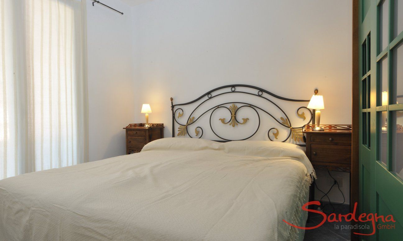 Apartment Castededdu 4 | Bedroom 1 with double sized bed and storage space Bedroom 1 with double sized bed and storage space