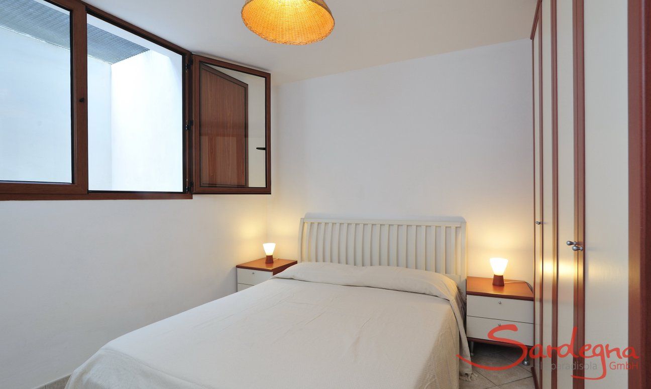 Villa Le Ginestre 2 | Bedroom 3 downstairs with double sized bed and storage space Bedroom 3 downstairs with double sized bed and storage space
