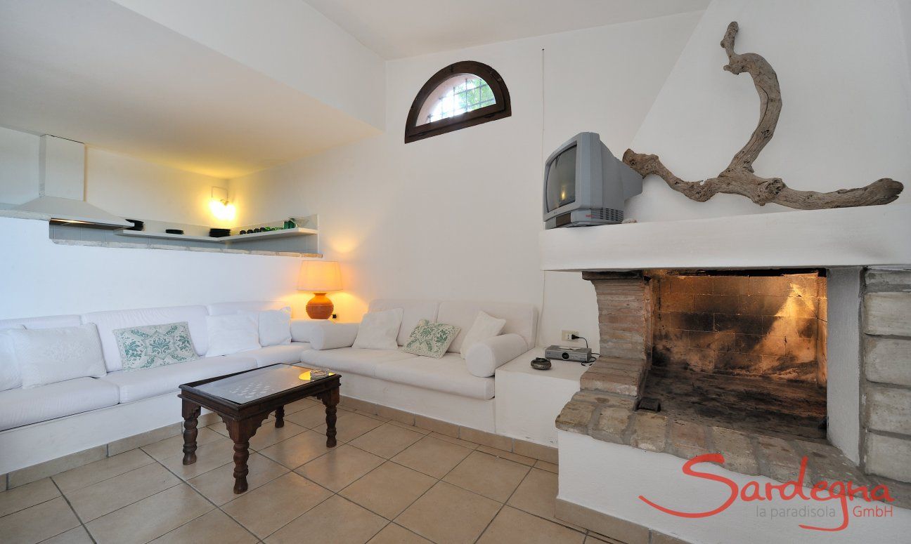 Villa Fiori 4 | Modern, bright living area with sofa and fireplace Modern, bright living area with sofa and fireplace