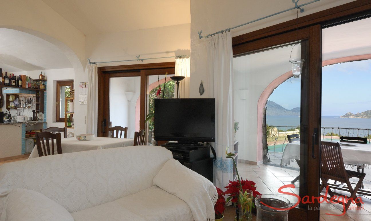 Villa Cala Ginepro | Living area with view on the isle of Tavolara Sardinia