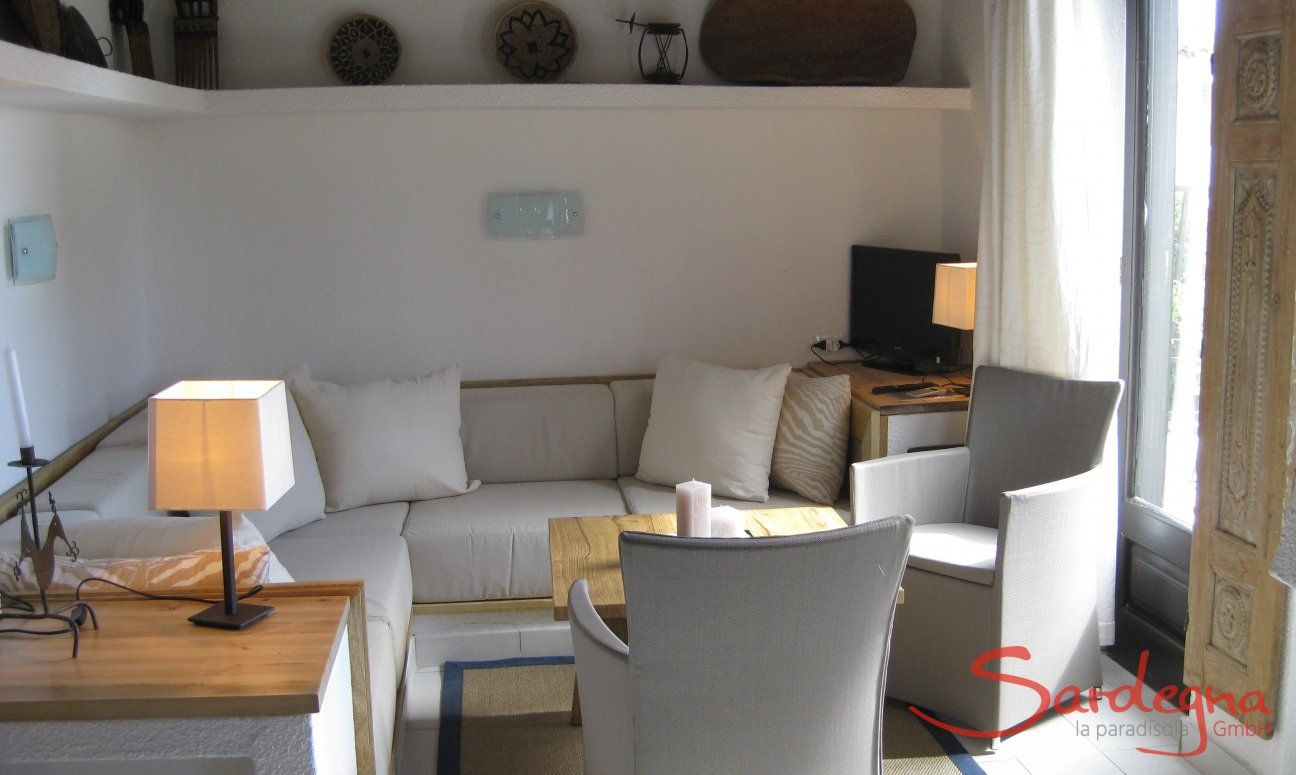 Villetta 3 | Living room with access via the terrace to the garden Living room with a beautiful sofa corner