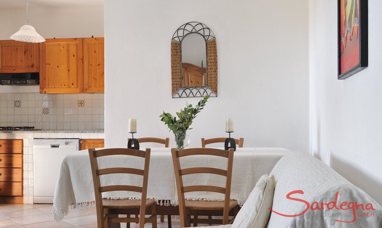 Apartment Castededdu 6 | Dining table, sofa corner and a view towards the kitchen Dining table, sofa corner and a view towards the kitchen