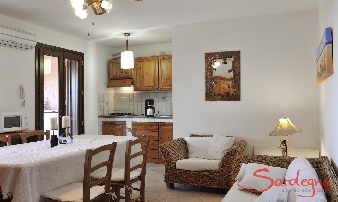 Apartment Castededdu 9 | Living area with dining table, sofa corner and kitchen Living area with dining table, sofa corner and kitchen