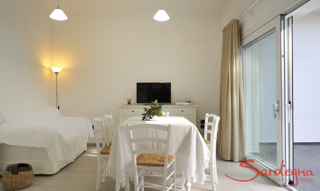 Apartment Cala Liberotto I | Bright living area with dining table Bright living area with dining table