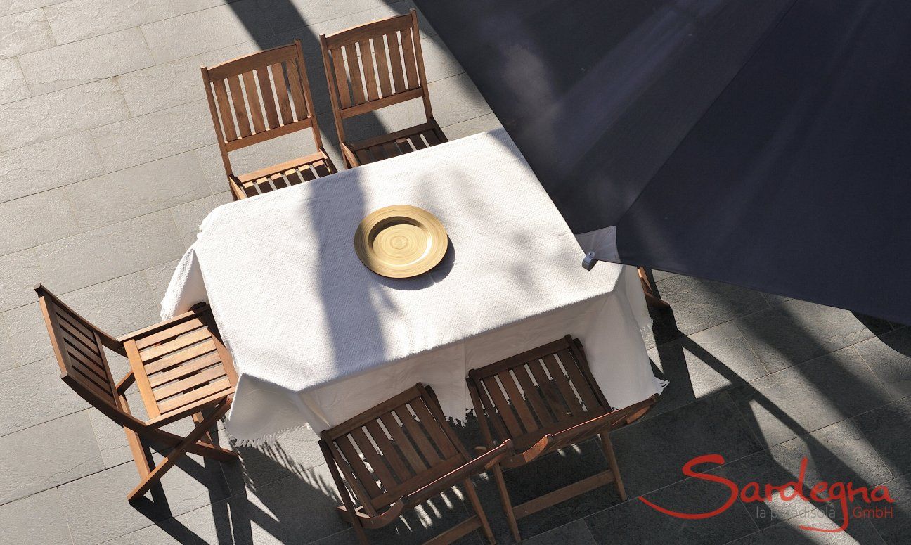Apartment Cala Liberotto I | Dining table on the terrace from above Dining table on the terrace from above