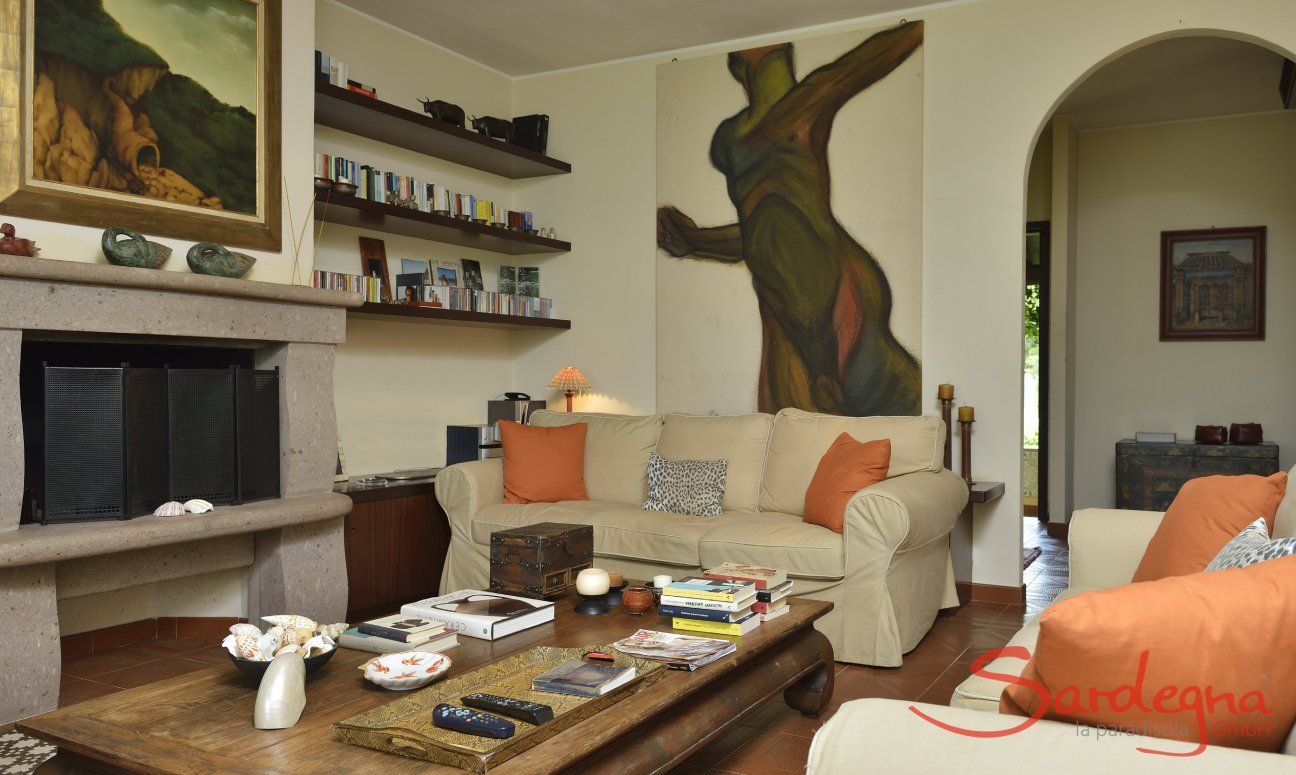 Villa Ulivi 12 | Living room with sofas, fireplace and garden view Living