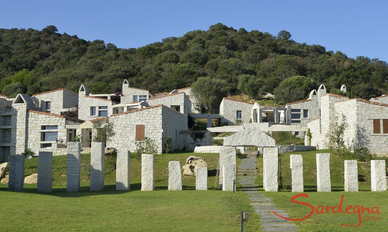 Holiday houses made out of grey granite rock form the complex Li Conchi