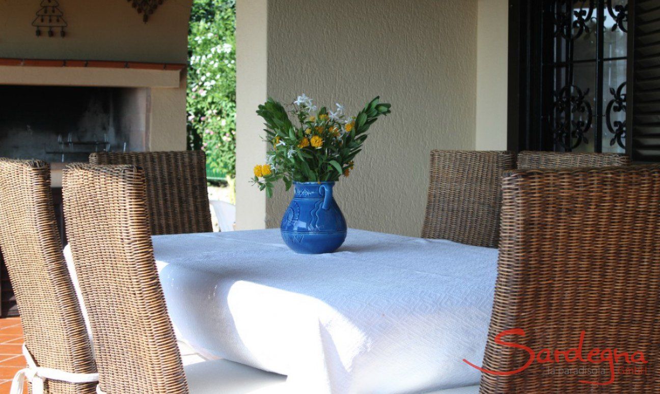 Villa Monica | Dining outside with the BBQ area in the back Dining outside with the BBQ area in the back