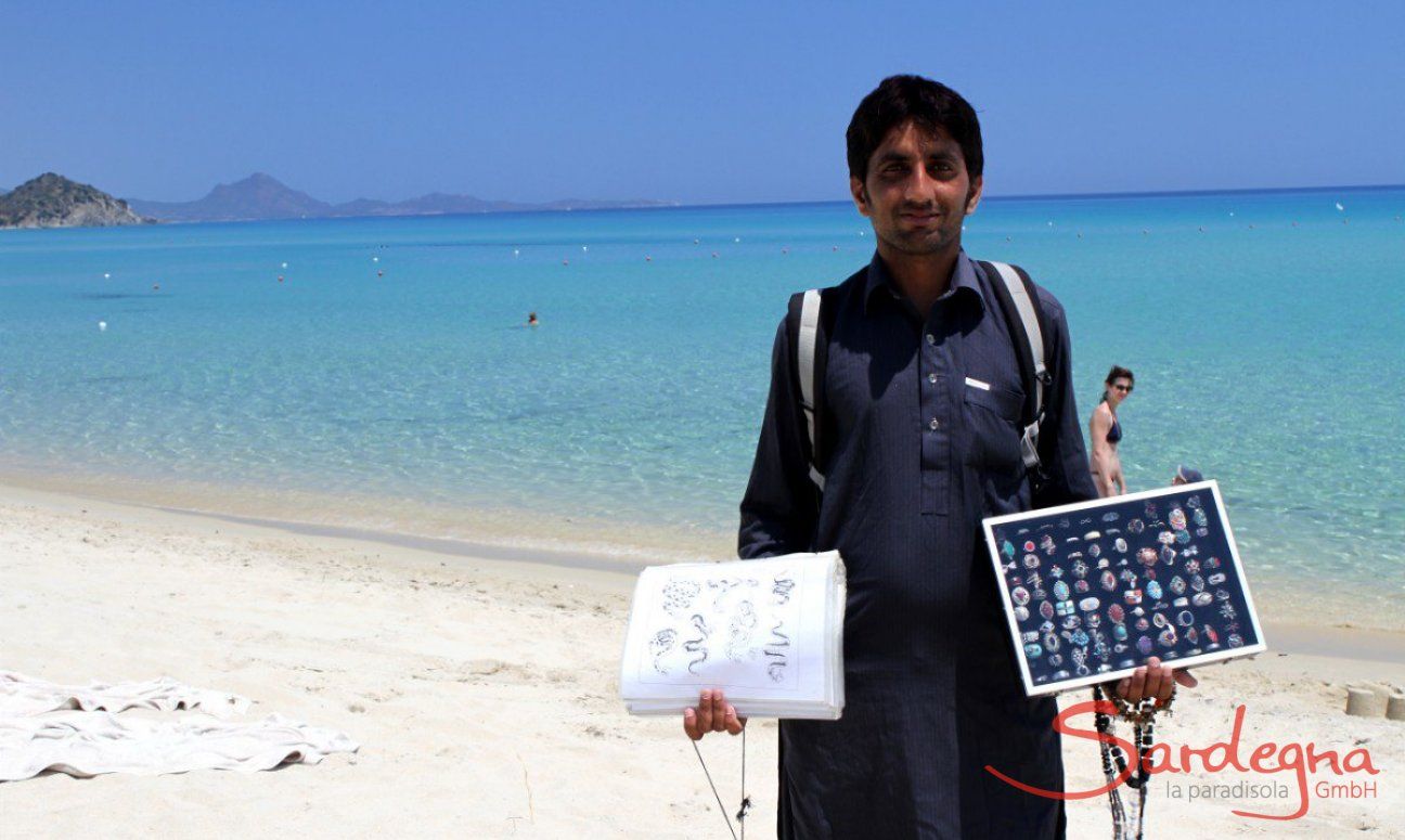 Selling jewellery on the beach of Cala Sinzias