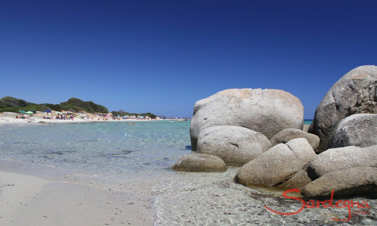Sant Elmo beach with crystal clear water and granite rocks