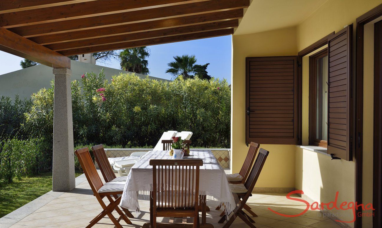 Villa Rosamar | Terrace with a dining table and sunbeds Terrace with a dining table and sunbeds