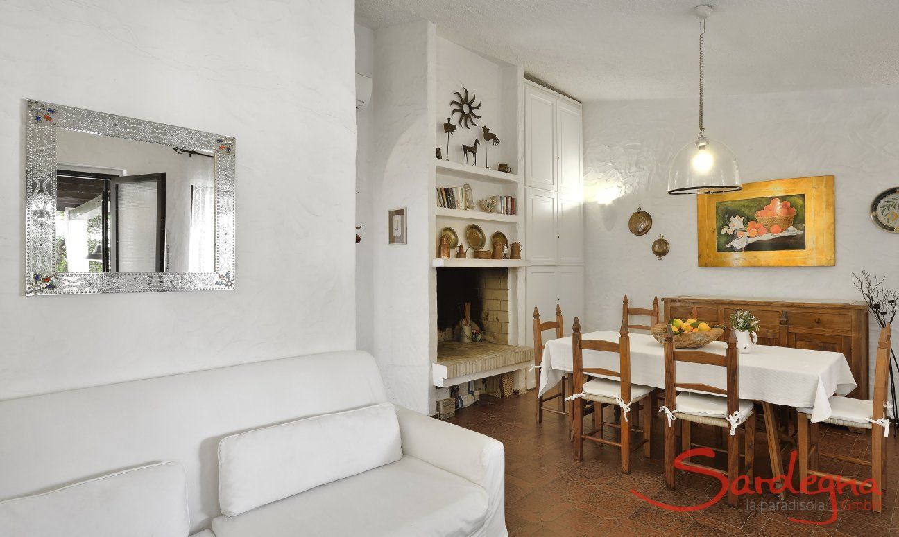 Living room with dining table and sofa corner  Villa Serena, Costa Rei