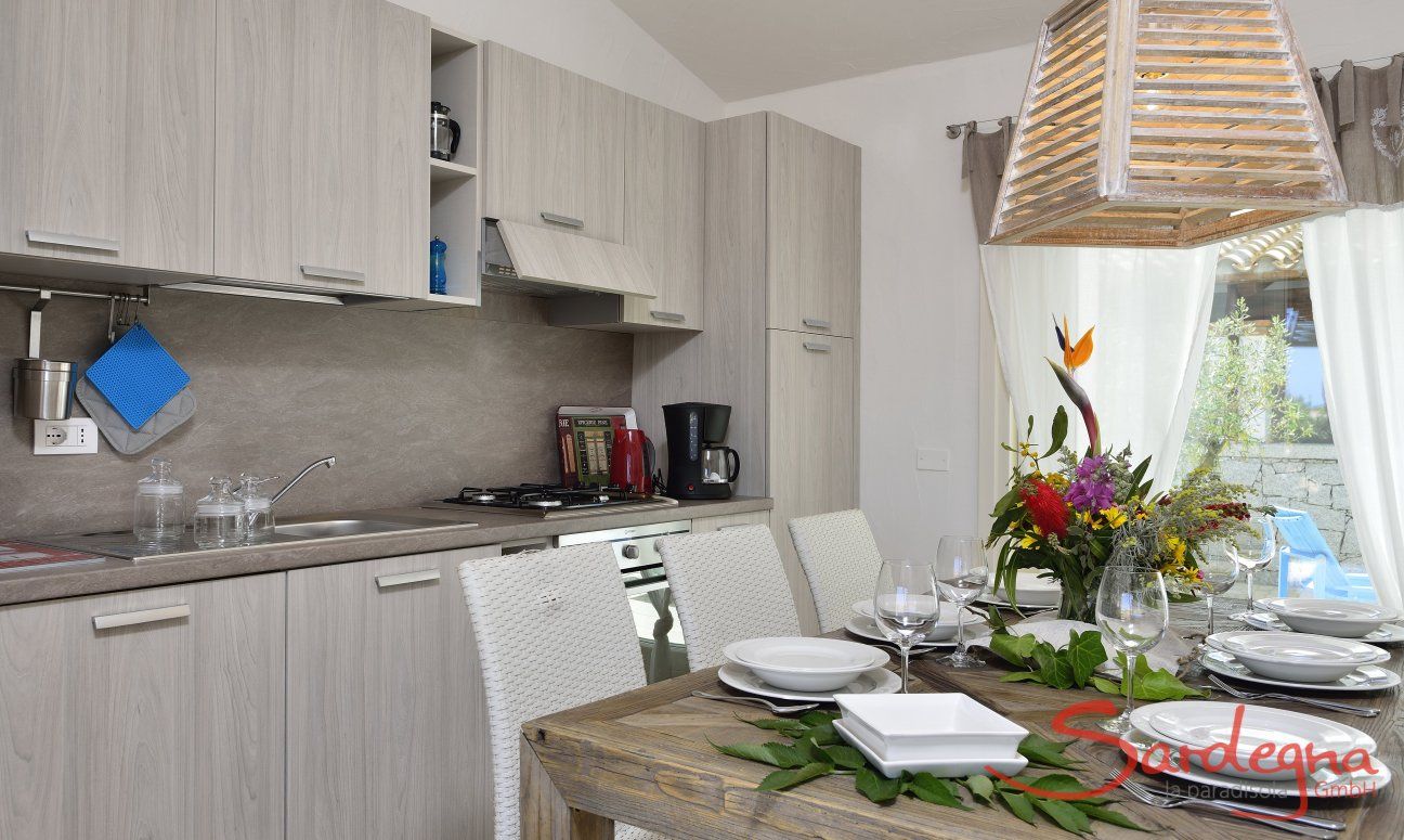 Villa Campidano 20 | Dining table with kitchenette Dining table and kitchenette of Villa Campidano 20