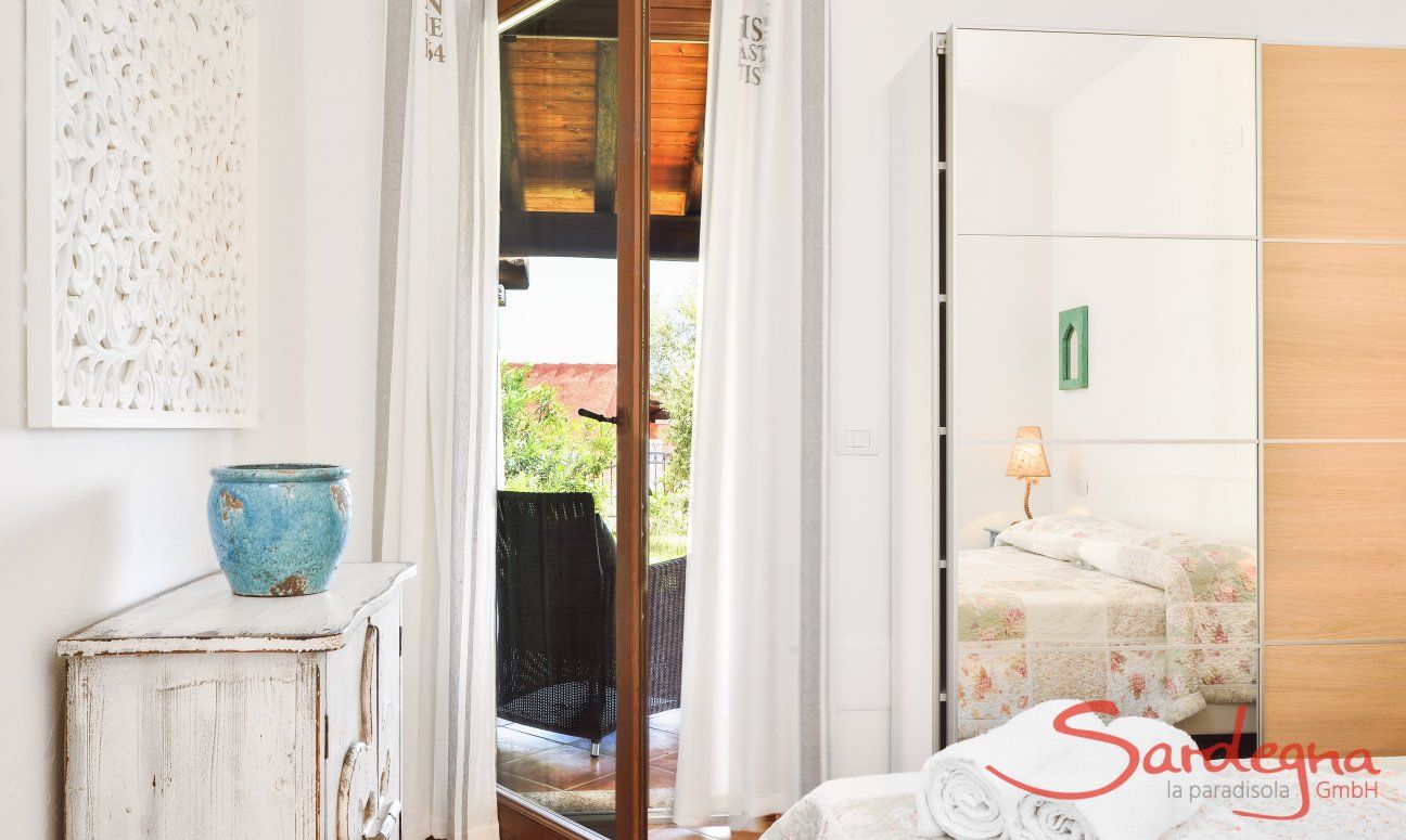 Villa Campidano 7 | Bedroom 1 with double sized bed and terrace access Bedroom