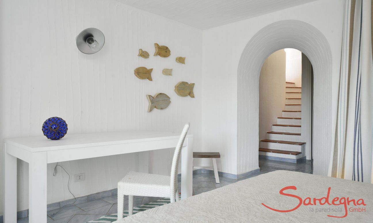 Li Conchi 16 | Bedroom 3 with desk and stairs leading to the first floor Bedroom, basement floor