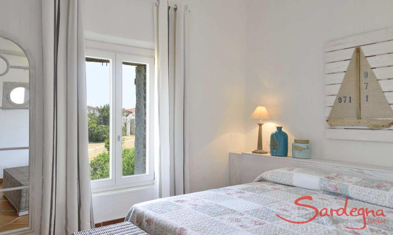 Li Conchi 14 | Bedroom 1 with double bed and door to the garden Bedroom