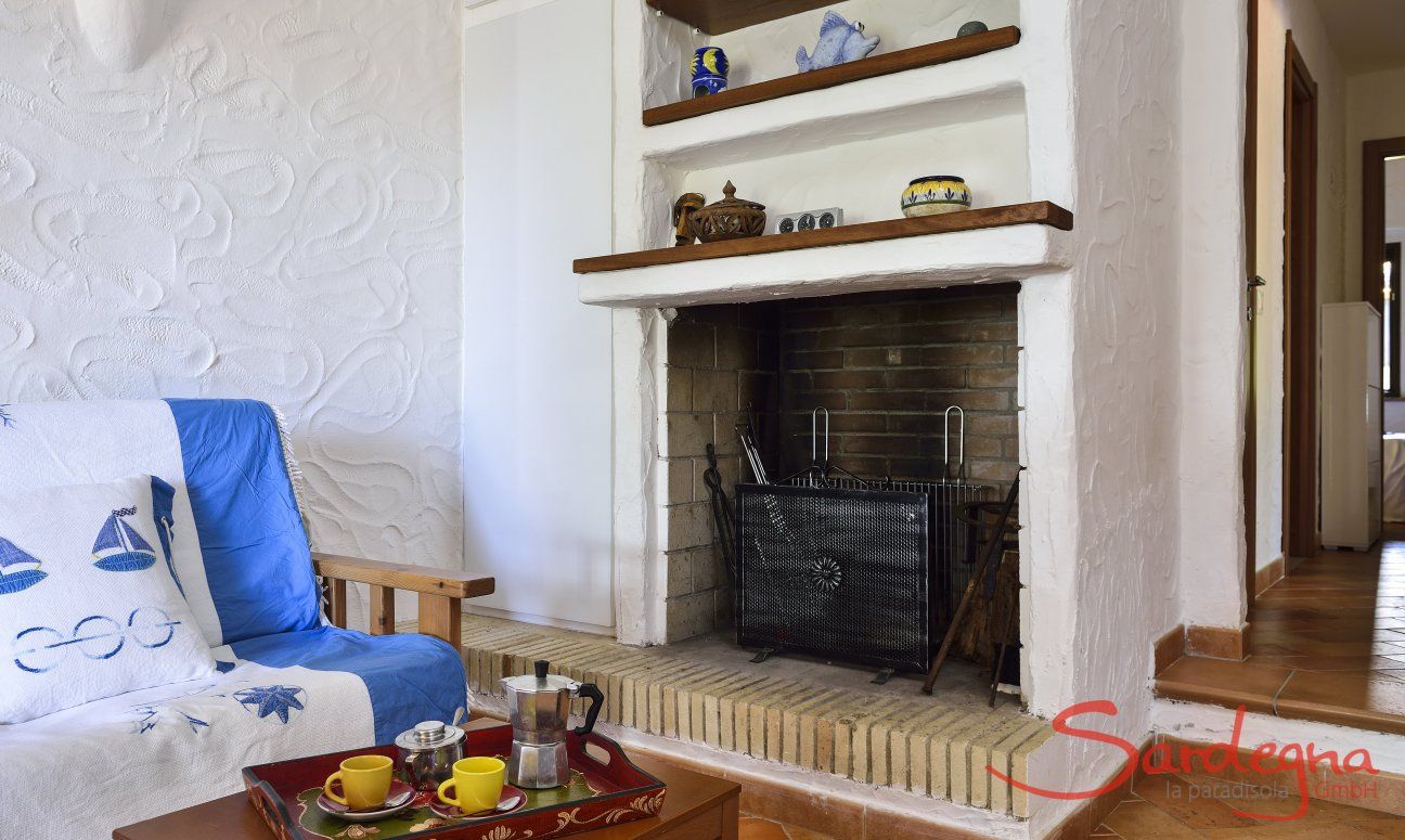 Villa Gaia | Fireplace close to the sofa corner Chimney at the sofa corner