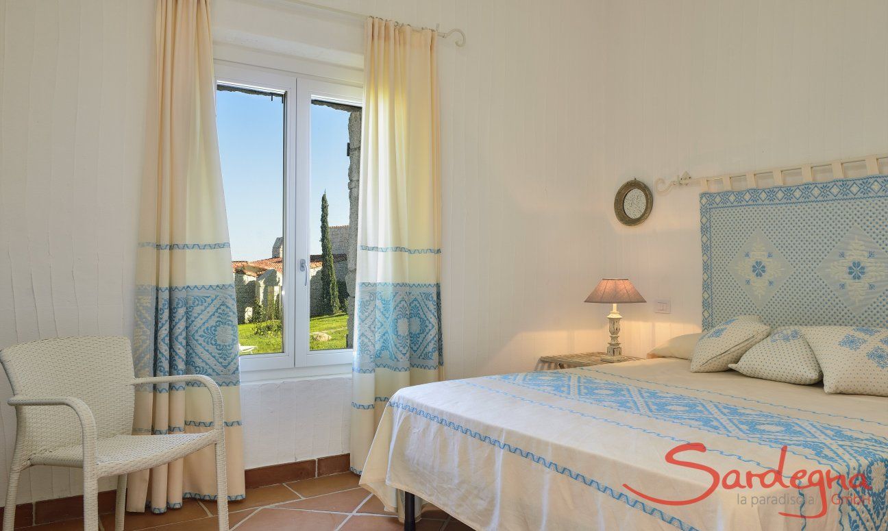 Li Conchi 9 | Bedroom 1 with double bed and garden view Bedroom with double bed and fabrics decorated in sardinian style Li Conchi 9, Cala Sinzias