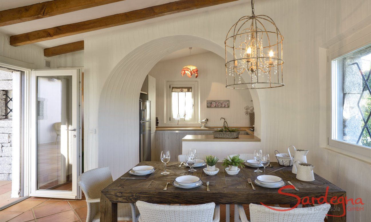 Li Conchi 9 | Dining table and view into the kitchen Dining table and view into the kiitchen Li Conchi 9, Cala Sinzias