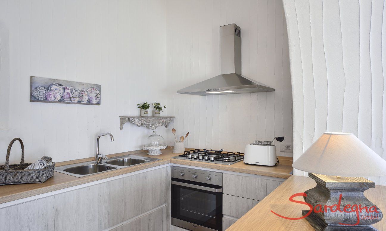 Li Conchi 10 | Stylish kitchen with stove, oven, hood and sink Kitchen Li Conchi 10, Cala Sinzias