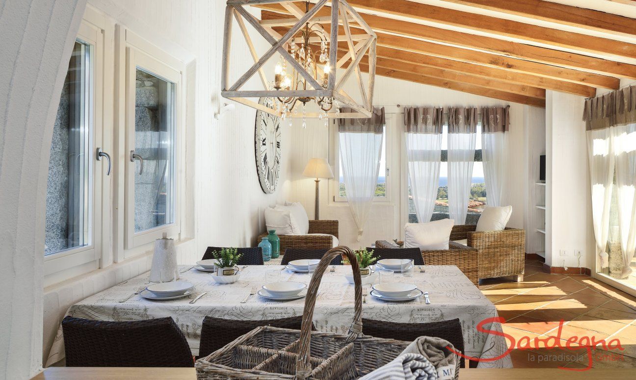 Li Conchi 10 | Bright and airy living room with dining table and sofa Living Room Li Conchi 10, Cala Sinzias