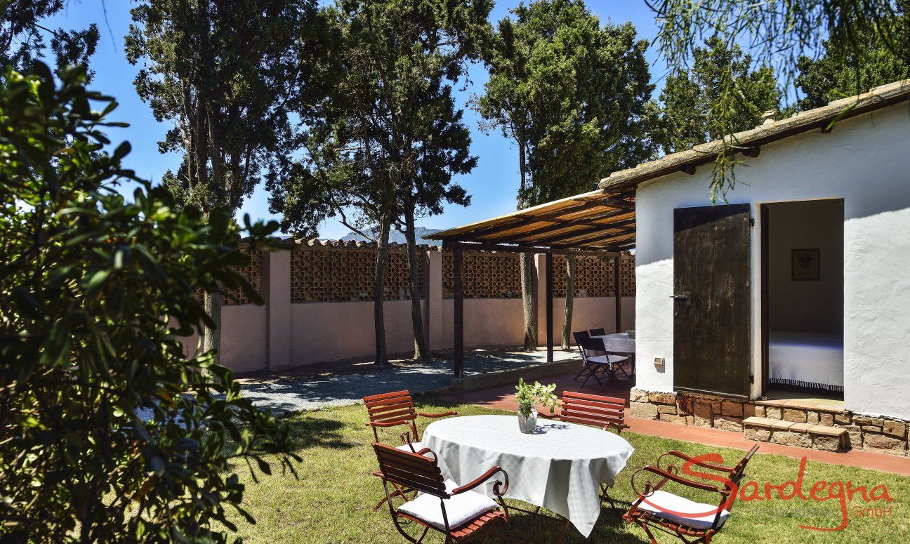 Casa Su Faru 5 | View of the garden, house and wall surrounding Su Faru View of the garden, house and wall surrounding Su Faru