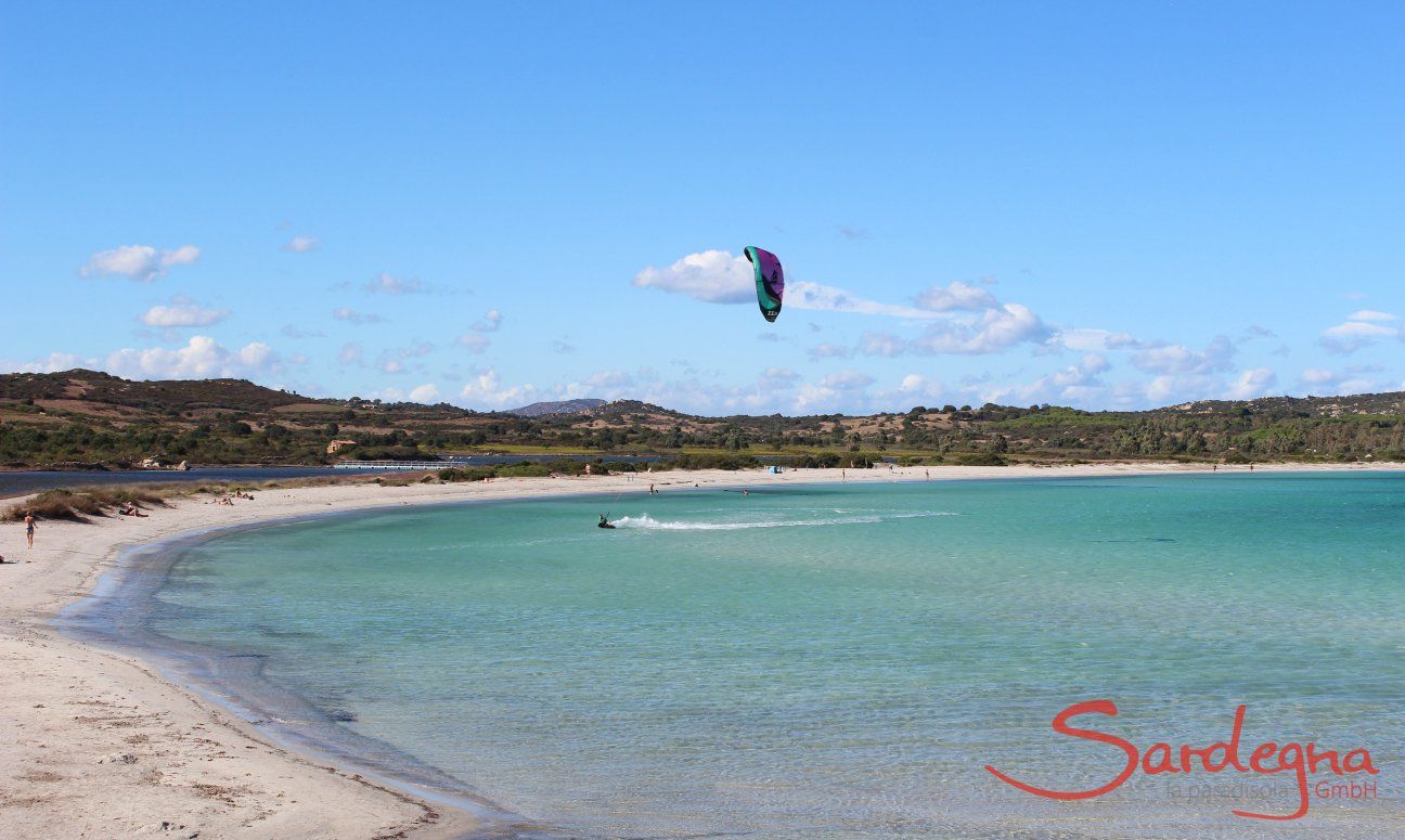 Beach of Lu Impostu with kite surfer
