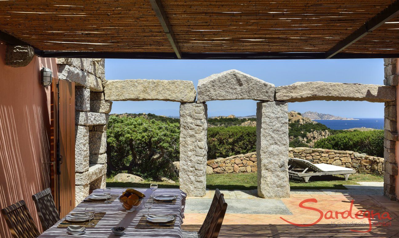 Villa Domus 9d | Roofed terrace with dining table Roofed terrace with dining table