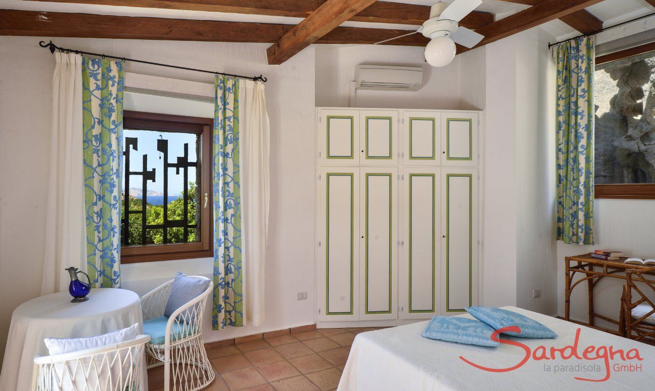 Villa Domus 9d | Bedroom 1 with a small table Bedroom 1 with a small table