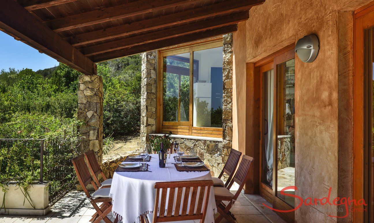 Villa Torretta Chia | Dining area outside with sea view Dining area outside