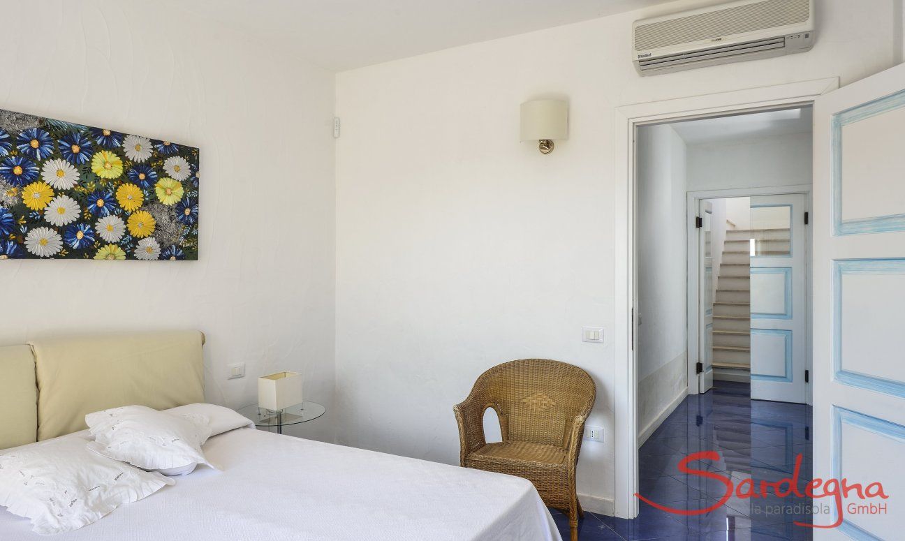 Villa Torretta Chia | Bedroom 1 with double sized bed and view towards the corridor has a private bath Bedroom 2 with double sized bed and view towards the corridor