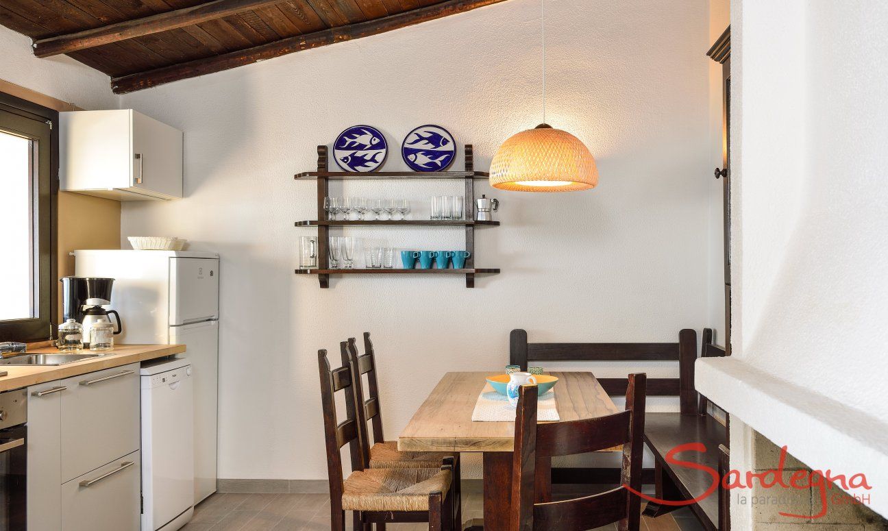 Apartment Nido 1 | Kitchenette with dining area and fire place After Restauration 2017