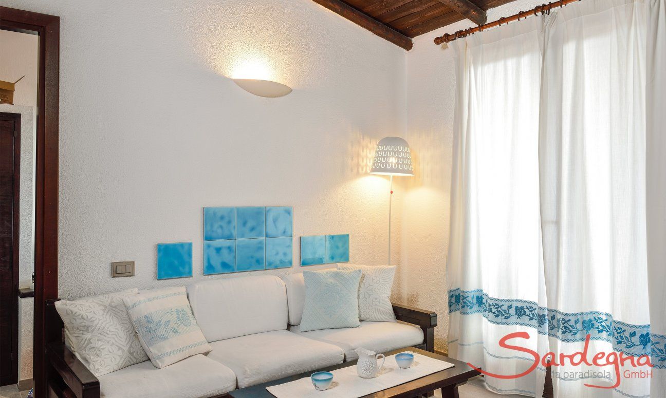 Apartment Nido 1 | Sofa and matching sardinian curtains Sofa