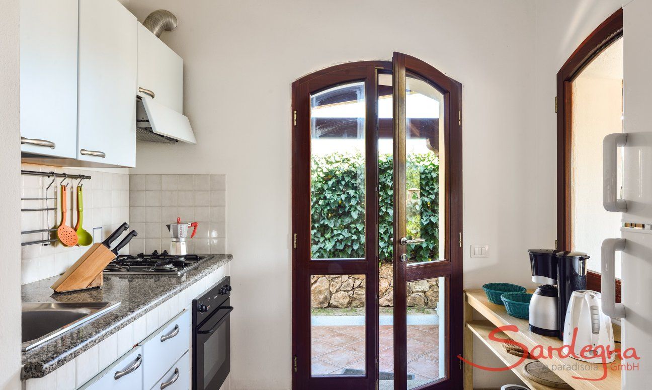 Villa Le Ginestre 2 | Kitchen upstairs with garden access Kitchen upstairs with garden access