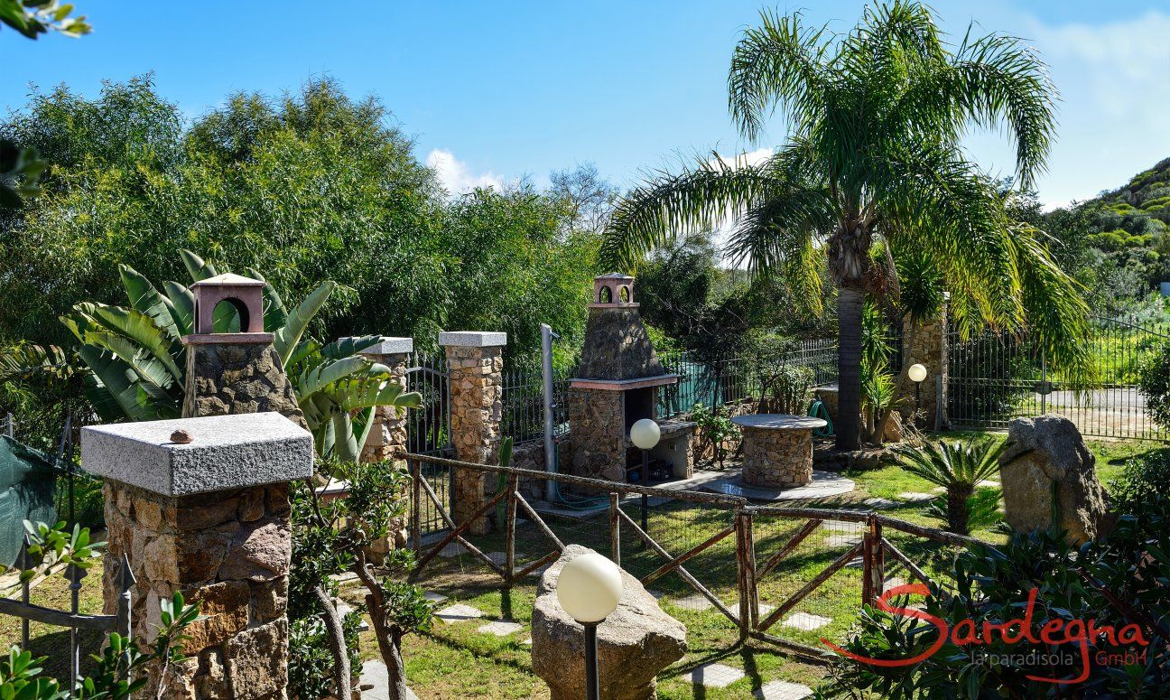 Villa Le Ginestre 2 | Garden owith brick barbeque Garden owith brick barbeque