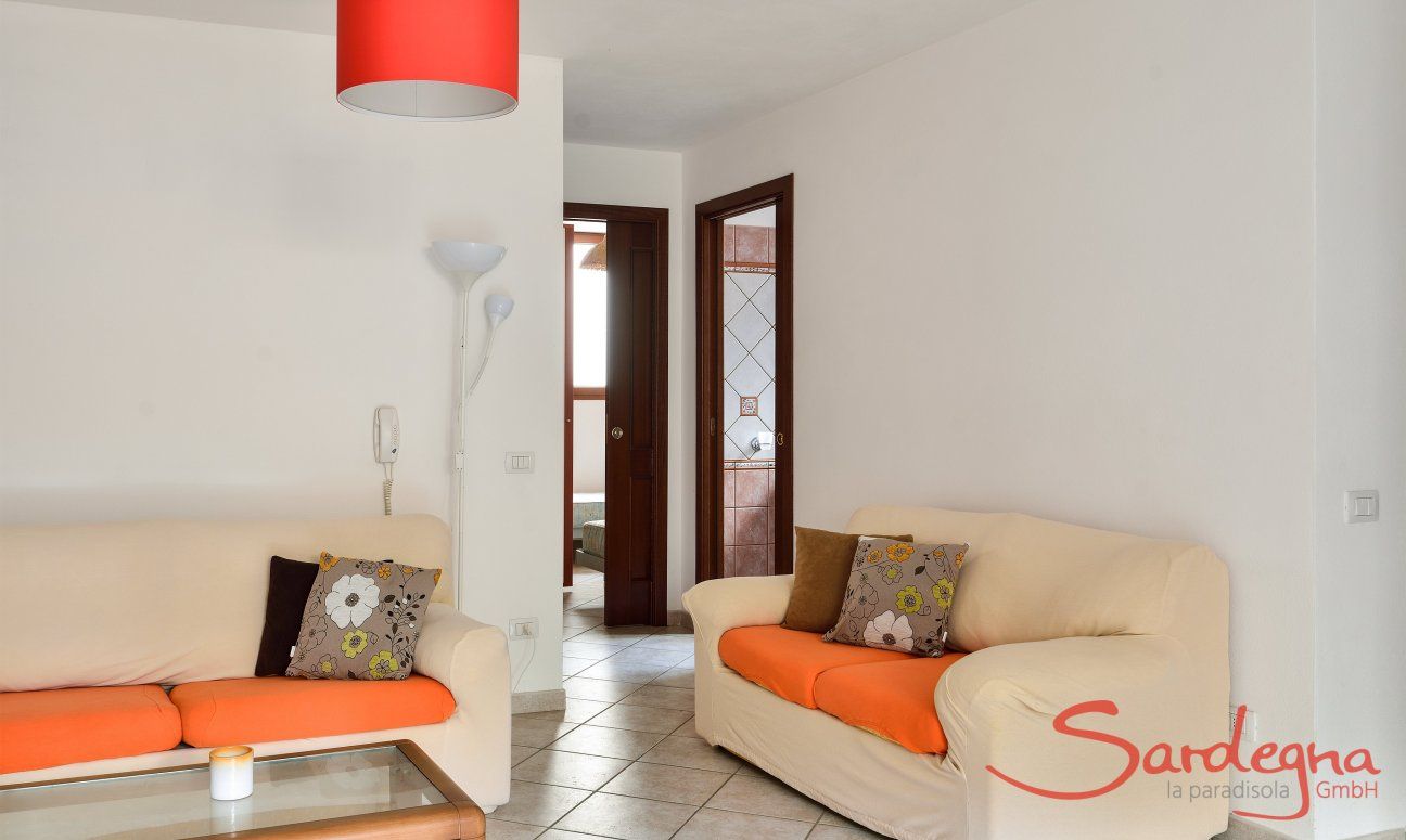 Villa Le Ginestre 2 | Living souterrain with a sofa corner Living souterrain with a sofa corner
