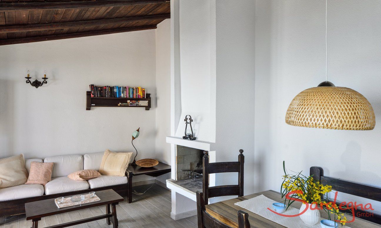 Living room with dining table and sofa corner