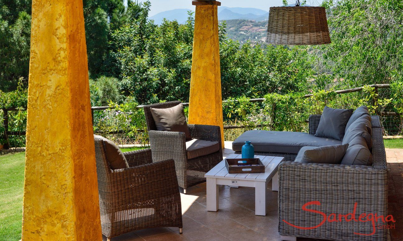 Roofed terrace with a garden view 