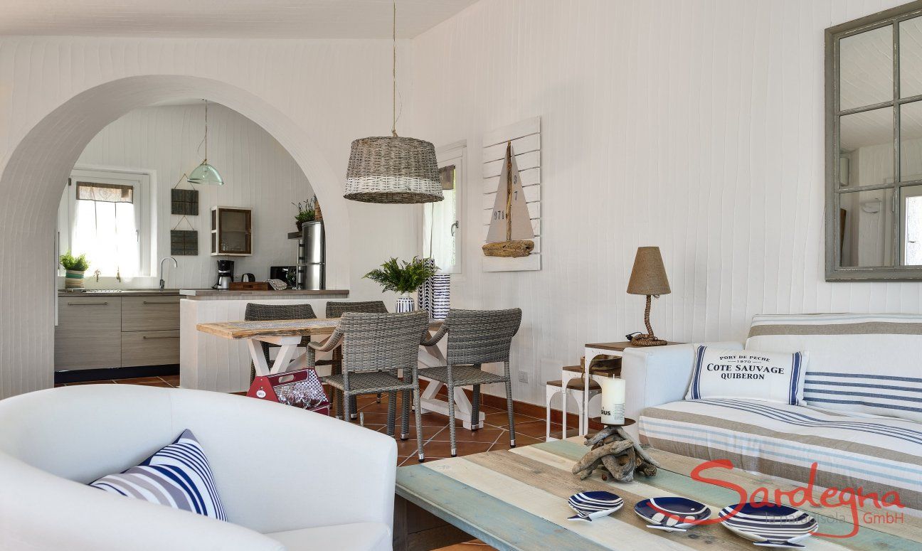 Li Conchi 4 | Living room with a view towards the open kitchen in the background Living with dining area and kitchen in the background