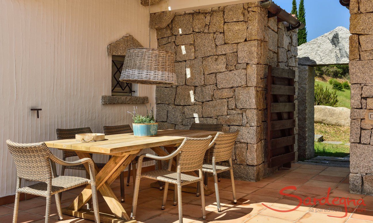 Li Conchi 5 | Covered dining area on the terrace Dining table on the terrace of the holiday home Li Conchi 5