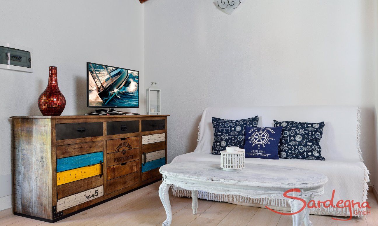 Villa Chiara | Modern living area with sofa corner and TV Modern living area with sofa corner and TV