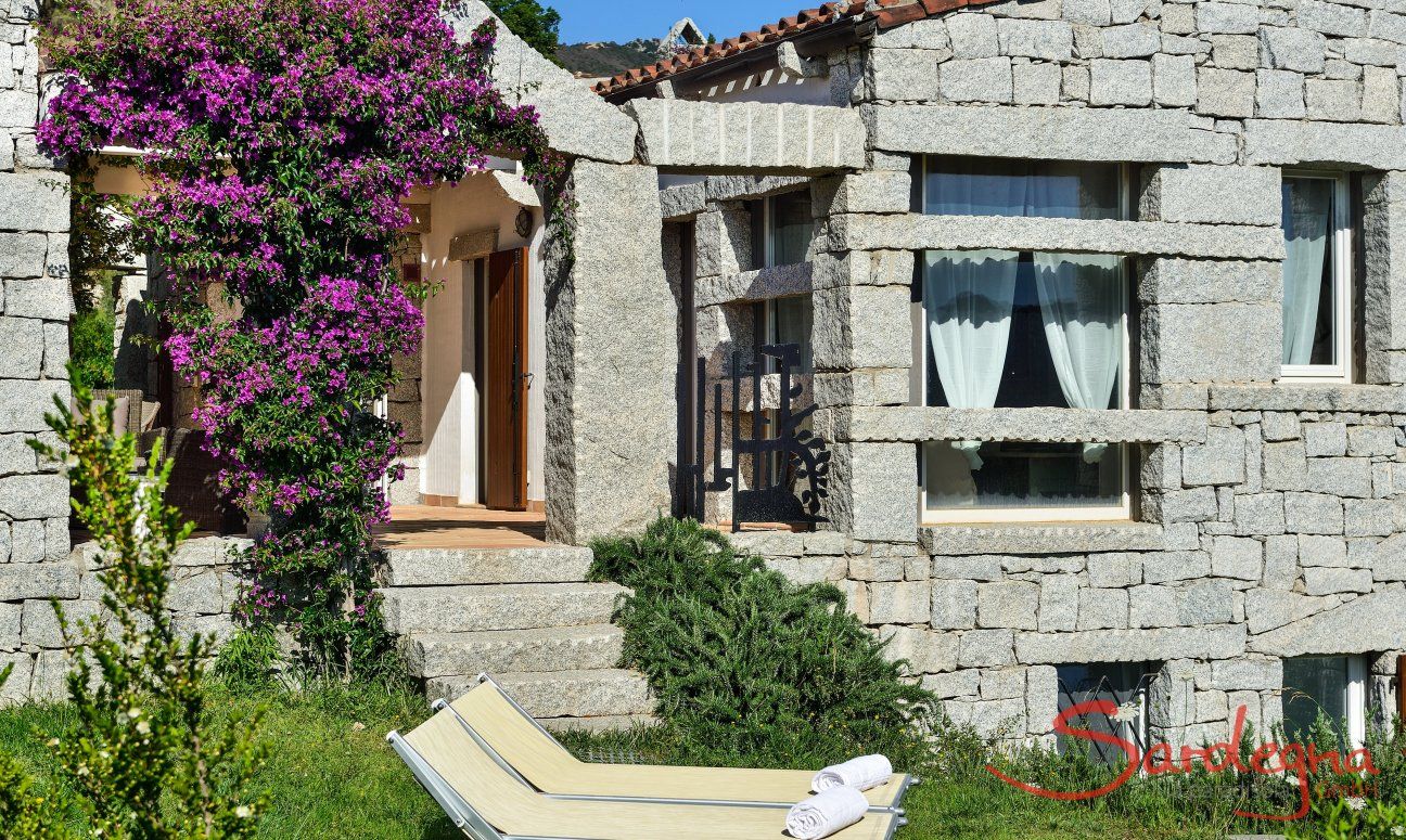 Li Conchi 15 | House in granite with blooming bougainvillea View of the House