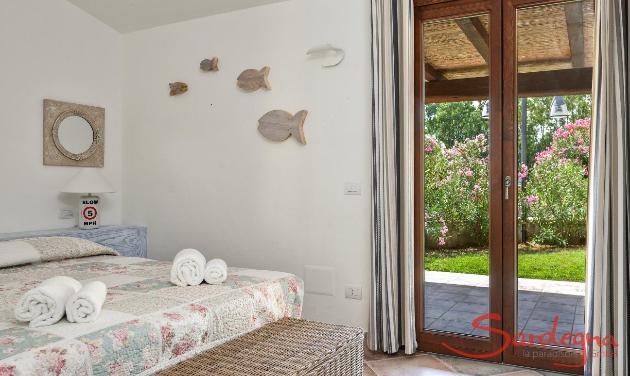 Villa Campidano 8 | Bright bedroom 1 with an outdoor view Bedroom and garden